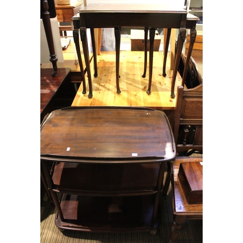 231 - A three tier trolley and a walnut veneer nest of tables