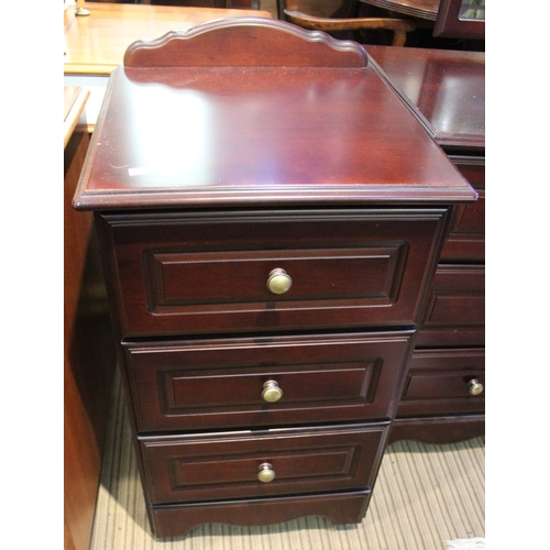 255 - A part bedroom suite comprising chest of drawers, dressing table and bedside tables 