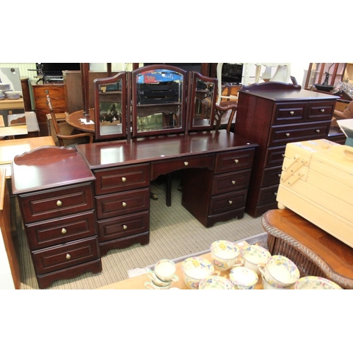 255 - A part bedroom suite comprising chest of drawers, dressing table and bedside tables 