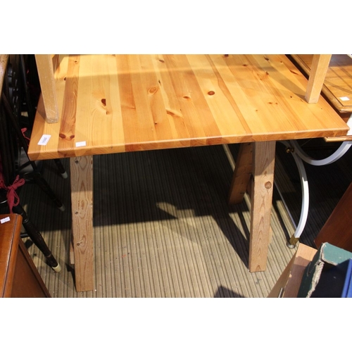 258 - A pine table with trestle supports