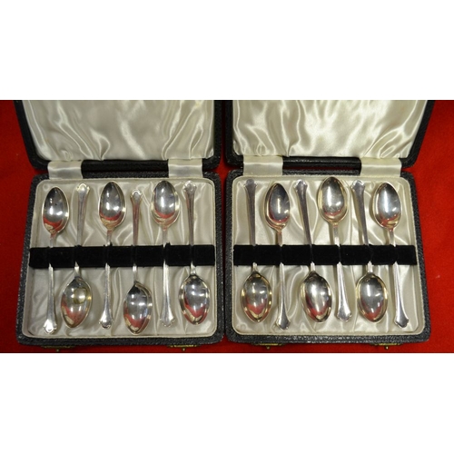 26 - Two cases of six silver coffee spoons, each Birmingham 1947, together with a set of four silver blad... 