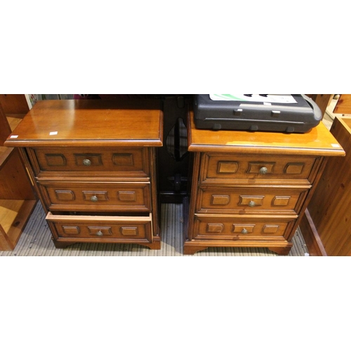 263 - A pair of reproduction three drawer bedside cabinets