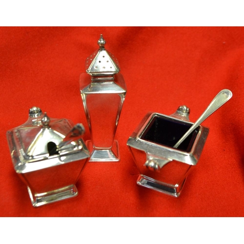 27 - A quantity of silver plate includes a cased set of six napkin rings, toast rack, three piece Art Dec... 