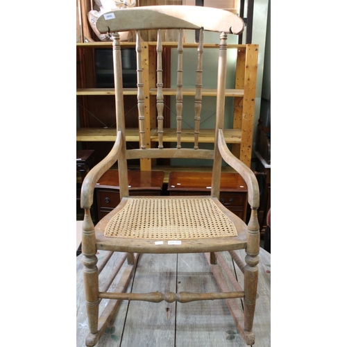 273 - A spindle backed rocking chair with bergere seat