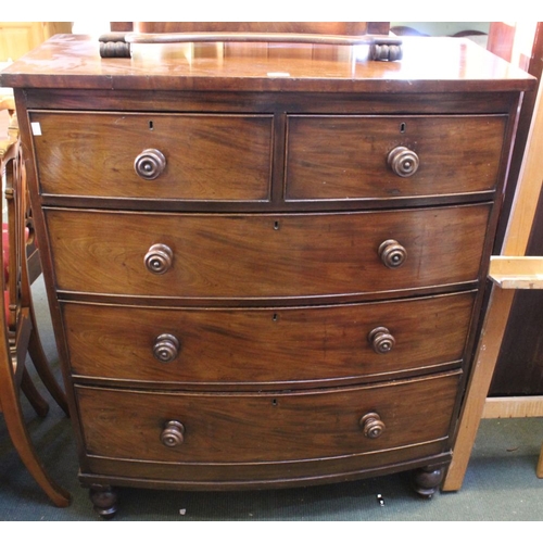 280 - A bow front chest of drawers, two short over three long drawers with carved wooden knobs on bun feet