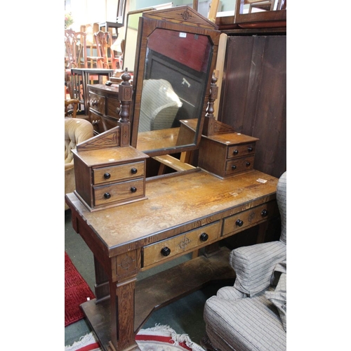 283 - A 19th century aesthetic movement grain painted dressing table with mirror upstand. Fitted with four... 