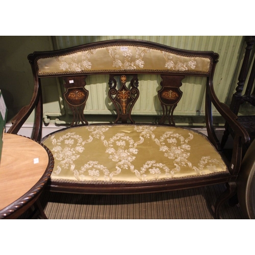 299 - An Edwardian decoratively inlaid salon two seater settee, with open scroll arms, upholstered seat an... 