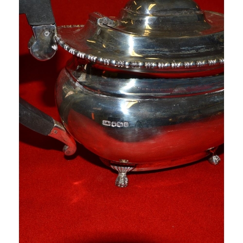 30 - Emile Viner, a silver teapot of Georgian design, raised on cast claw feet, Sheffield 1930, gross wei... 