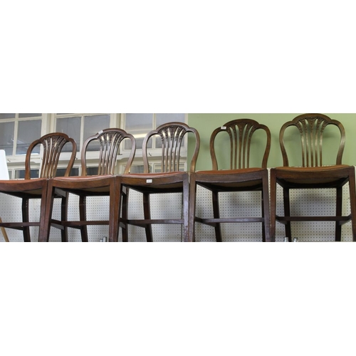 332 - A set of six late Georgia design single dining chairs, the splat backs with graduated bell husk carv... 