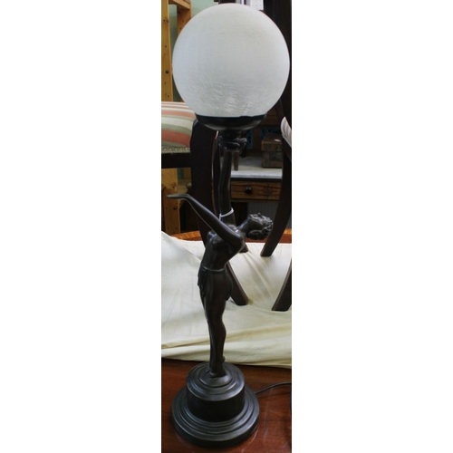 333 - An Art Deco design figurative table lamp, modelled as a bronzed lady, supporting an opaque crackle g... 