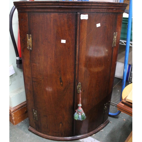 379 - A  c.1900 mahogany bowfront corner cupboard