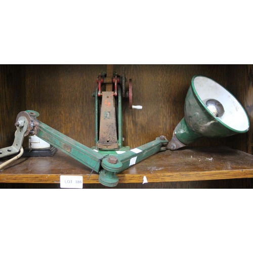 386 - A wall mounted adjustable industrial lamp together with a winding mechanism & a switch