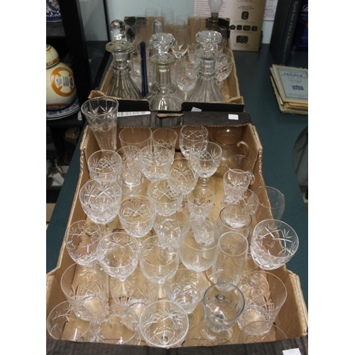 389 - Two boxes of assorted table glass, includes; decanters, vases, cut and plain, wines, whiskies, etc.