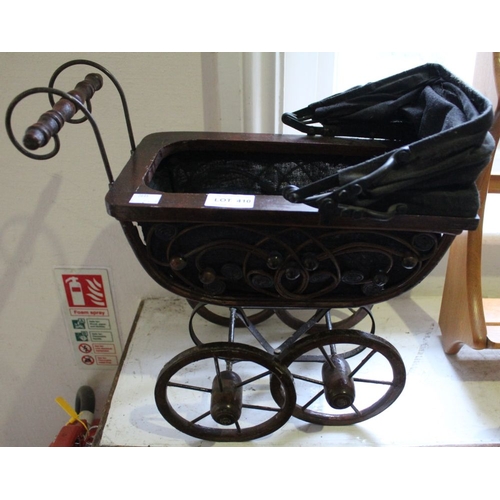 410 - A vintage model Dolls pram