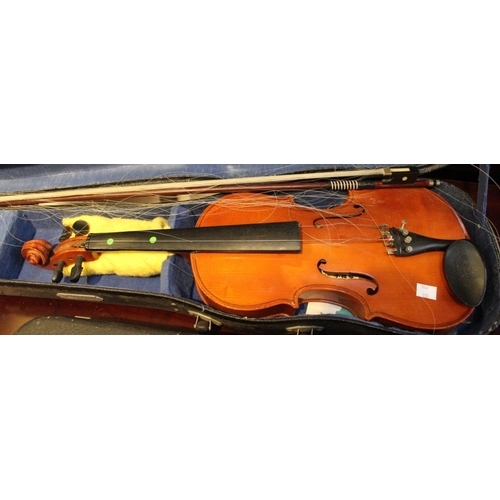 419 - A collection of three violins in cases