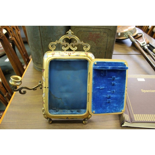 43 - A late 19th century gilt metal vanity mirror, having enamel decoration to the frame, fitted candle s... 