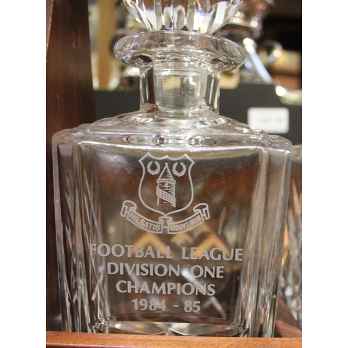 48 - An Everton Football Club, mahogany tantalus, fitted three cut spirit decanters, engraved, commemorat... 