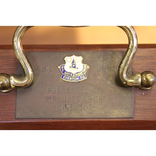 48 - An Everton Football Club, mahogany tantalus, fitted three cut spirit decanters, engraved, commemorat... 