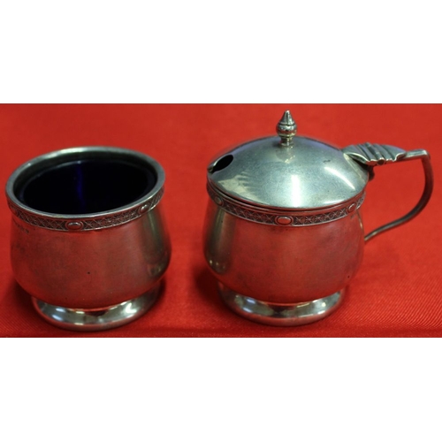 7 - Mappin and Webb, a silver lidded mustard and a salt, having banded rims, each with blue glass liners... 