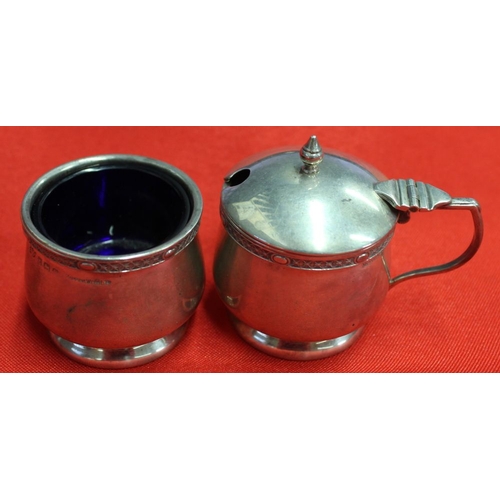 7 - Mappin and Webb, a silver lidded mustard and a salt, having banded rims, each with blue glass liners... 