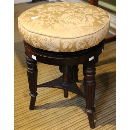 88 - An adjustable circular pad top piano stool