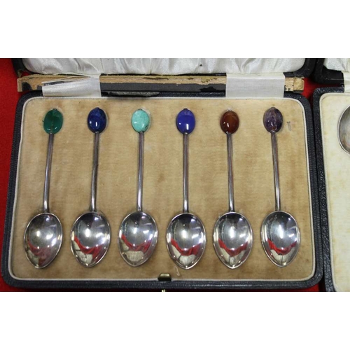 1 - A cased set of six  Art Deco silver & enamel teaspoons, and one other set with hardstone finials