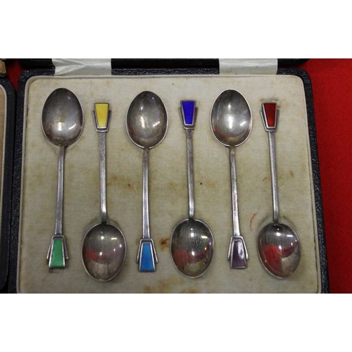 1 - A cased set of six  Art Deco silver & enamel teaspoons, and one other set with hardstone finials