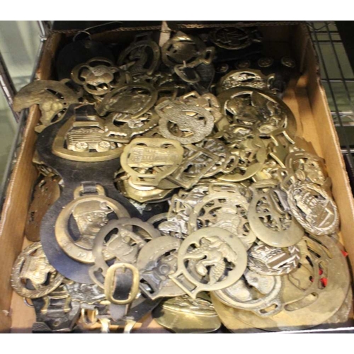 104 - A substantial collection of horse brasses and some leathers