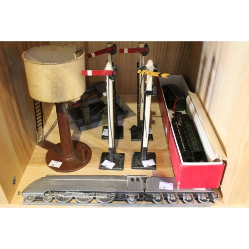 153 - A selection of O gauge model railway accessories, signals, a buffer and a water tank. Plus a metal p... 