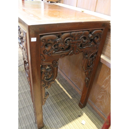 195 - An Oriental carved alter table,107cm width x 87cm in height