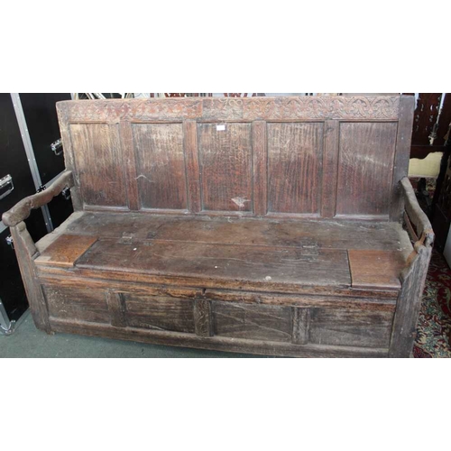 338 - An oak c.1700 box settle, Poor condition, missing bits, iron structural supports, discoloration, wea... 