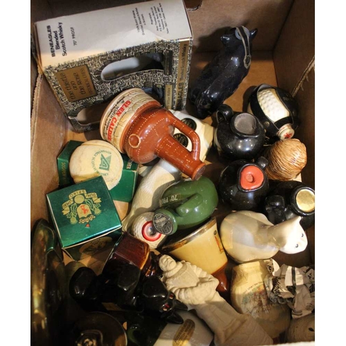 451 - A box containing a selection of whiskey miniatures