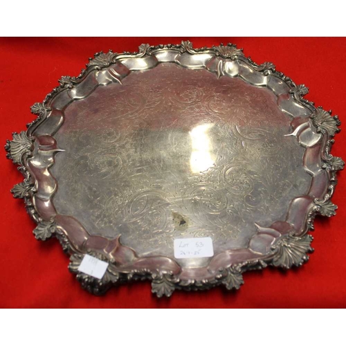 53 - A Victorian silver salver, having scallop cast rim, on three cast feet, the sole, acanthus leaf engr... 