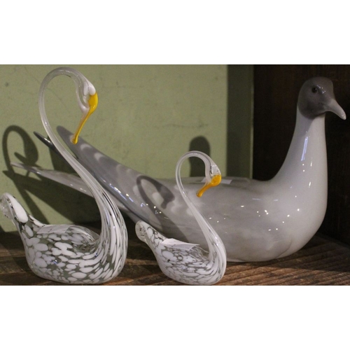 89 - A Lladro Arctic Tern together with two glass swans