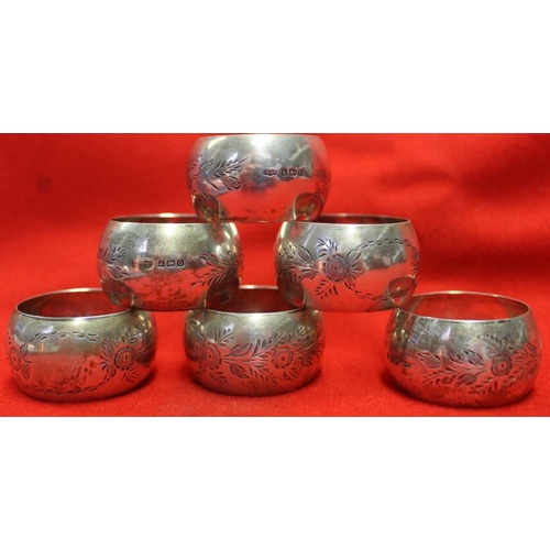 9 - A set of six silver napkin rings