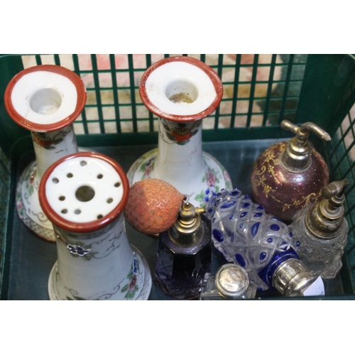 138 - A collection of decorative glass scent bottles, two with silver tops, together with ceramic dressing... 