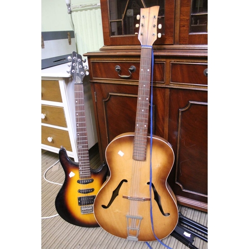 155 - An electric Washburn guitar, together with an acoustic guitar & stand