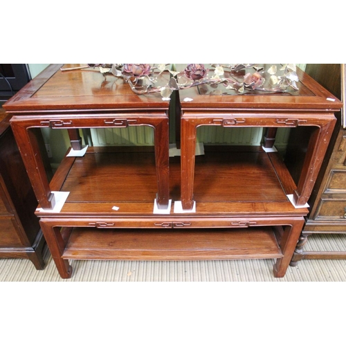 162 - An Oriental inspired coffee table together with two matching side tables