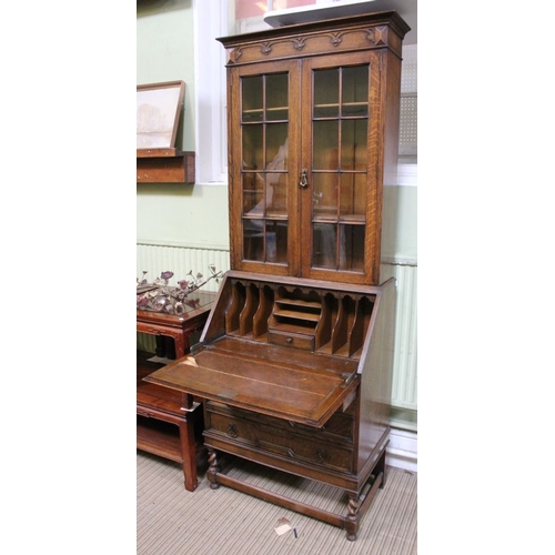 163 - A glazed bookcase/writing desk