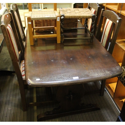 172 - A dark oak Ercol dining table of trestle design with a set of four Edwardian dining chairs