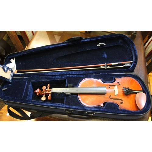 174 - A violin together with soft case