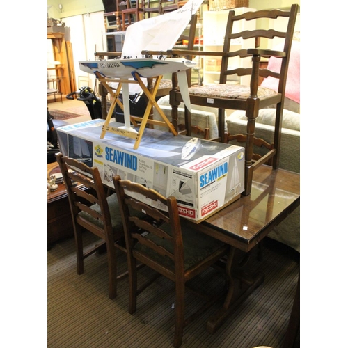 176 - An oak refectory table on trestle frame with a set of six ladder back dining chairs, two carvers