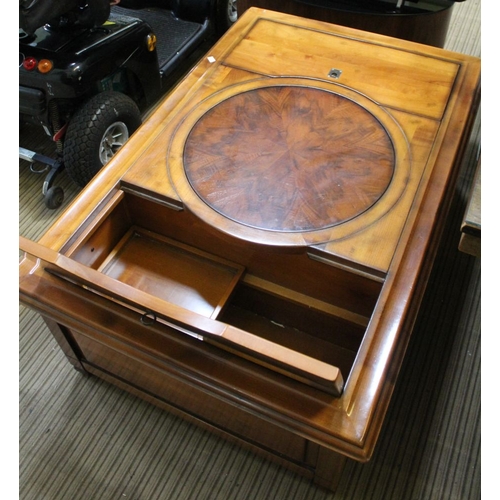 180 - A Lazy Susan coffee table, originally purchased from Lenley's, Canterbury. Lift up storage compartme... 