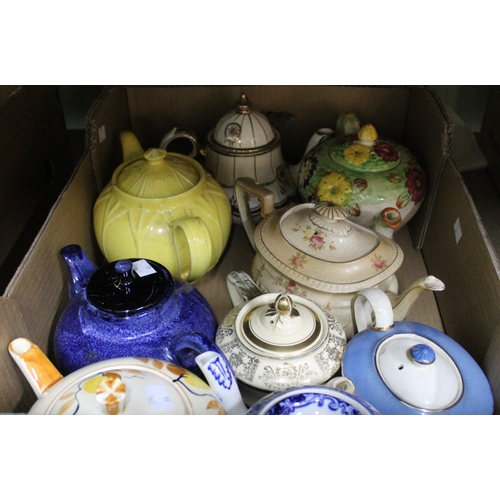 242 - A box containing a selection of teapots, various designs and makers