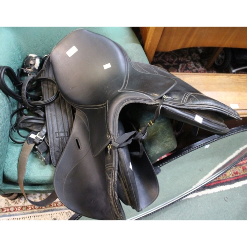 255 - A Tekna horse saddle together with associated straps