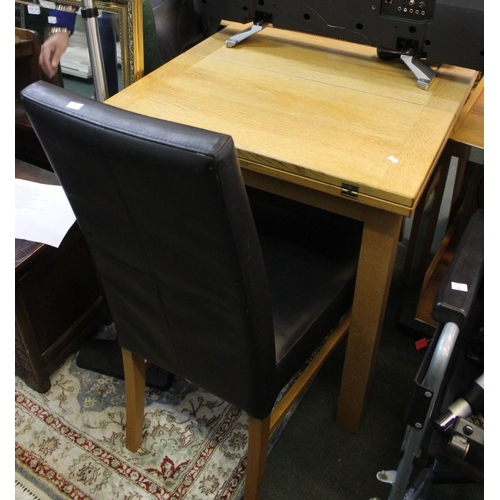 258 - A modern light oak twin flap flip top table with two leather effect chairs