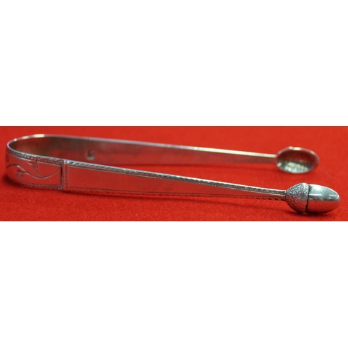 272 - A pair of Georgian silver sugar tongs, floral engraved with acorn tips, 42g