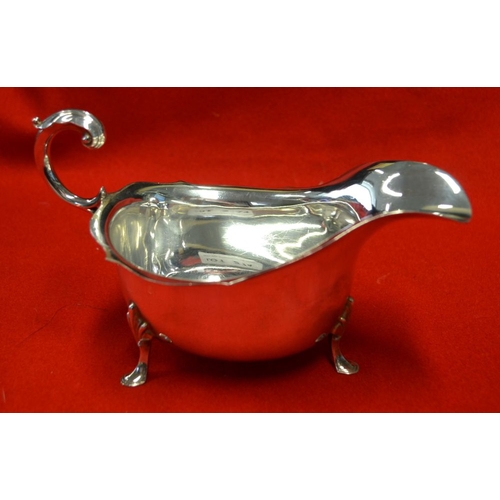 274 - A Georgian design silver gravy boat, with acanthus scroll handle, Sheffield 1959, 286g