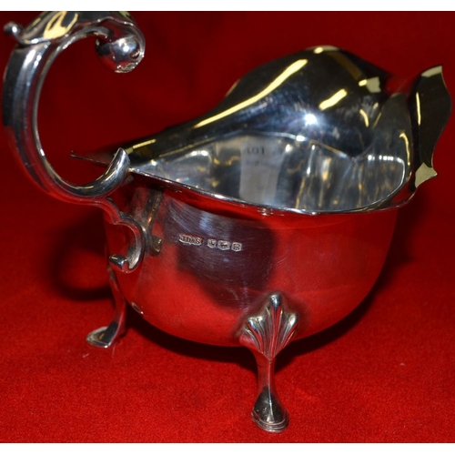 274 - A Georgian design silver gravy boat, with acanthus scroll handle, Sheffield 1959, 286g