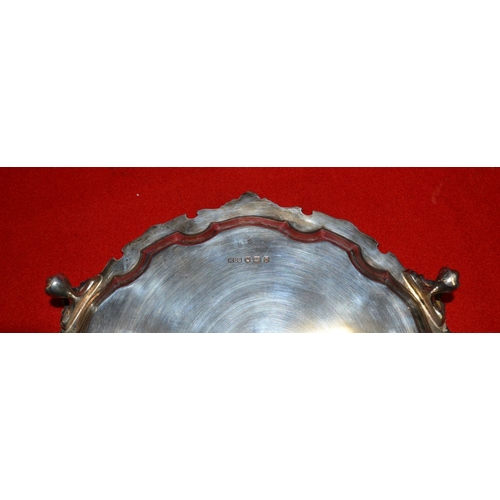 276 - A Georgian design silver salver, cast rim upon three claw feet, 21cm diameter, 370g